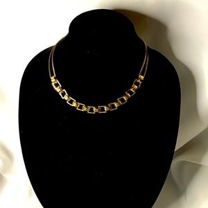 Gold necklace with darning on the chains$10